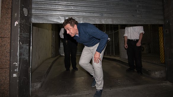  Former AFL player and coach Mark Thompson leaves Melbourne Magistrates Court after being bailed on charges of trafficking and possession of illegal drugs.