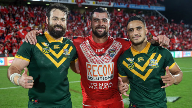 Mate against mate: Fifita poses with Aaron Woods and Valentine Holmes after the Tonga v Australia Test last year.