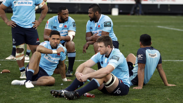 Bitter end: The Waratahs contemplate their semi-final defeat to the Lions.