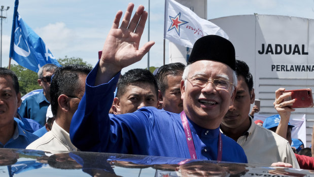 Malaysian Prime Minister Najib Razak waves to his supporters after his election nomination in Pekan, Pahang state, on Saturday.