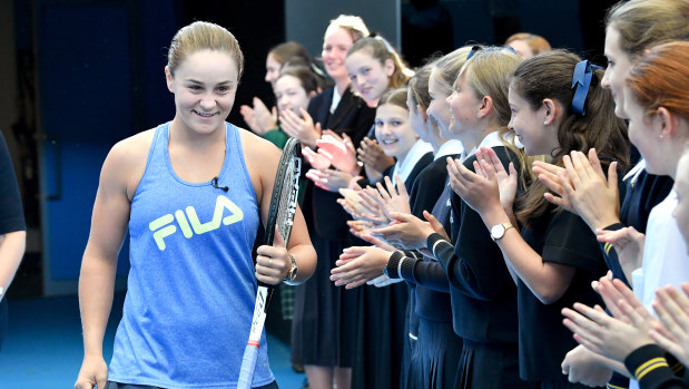 French Open winner and world number one tennis player Ashleigh Barty (left) is seen being welcomed home at Pat Rafter Arena in Brisbane.