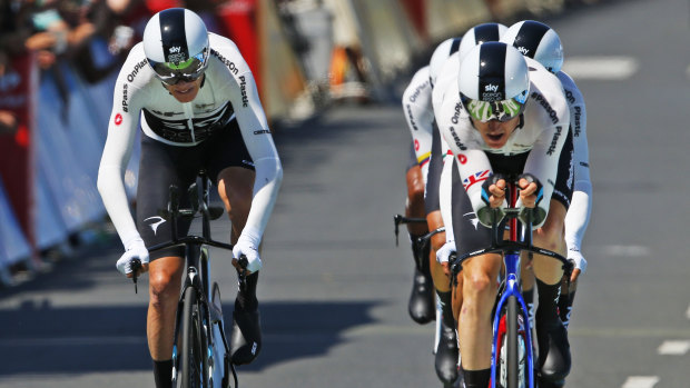 Chris Froome, left, sprints towards the finish line with his teammates during the third stage.