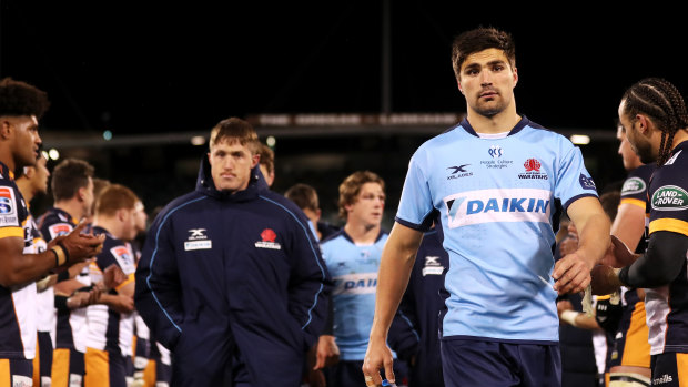 The Waratahs trudge from GIO Stadium after their 27-point loss to the Brumbies. 