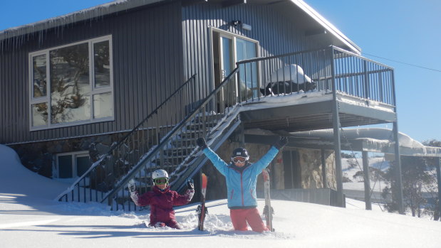 The girls play in the snow outside Numbananga Lodge.