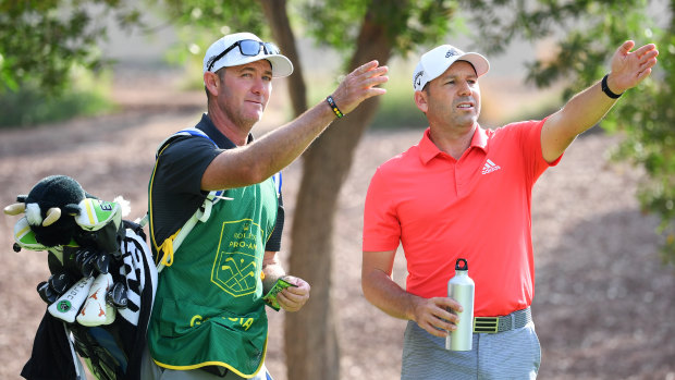 Heading south: Garcia chats to caddie Michael Kerr during practice prior to the DP World Tour Championship Dubai at Jumeirah Golf Estates earlier this month.