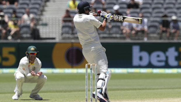 Hostile: Ishant Sharma stands up to some nasty quick bowling on day five.