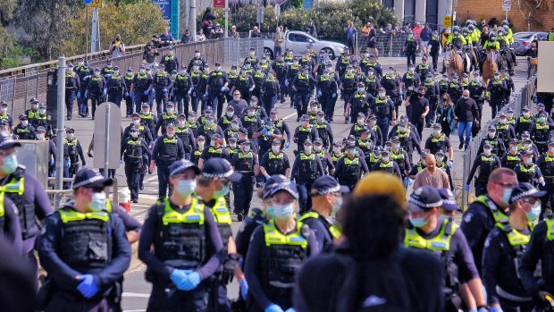 Police in Melbourne during an anti-lockdown protest on Saturday.