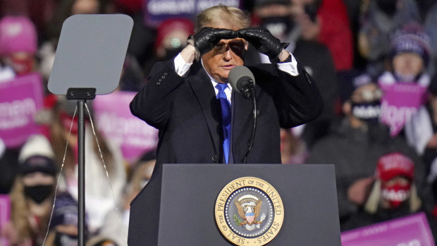 US President Donald Trump surveys the crowd in Nebraska.