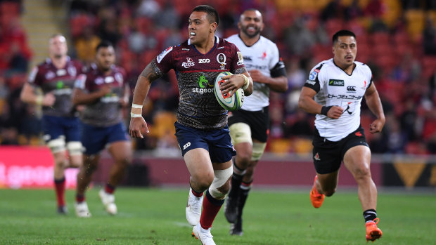 Untouched: Duncan Paia'aua makes a long run to the try line at Suncorp Stadium.