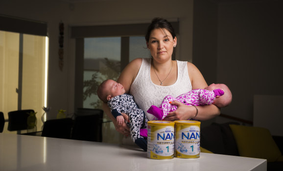 Googong mum Tegan Shirbin, with her 11-week-old twins Troy and Octavia, struggles to buy enough baby formula due to restrictions put in place by retailers.