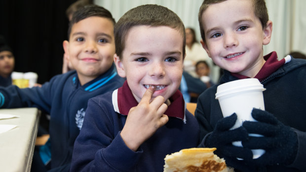 Connor Rusteau-Hagarty with brothers, Jaykob and Blair Cash at the free breakfast club at their school.