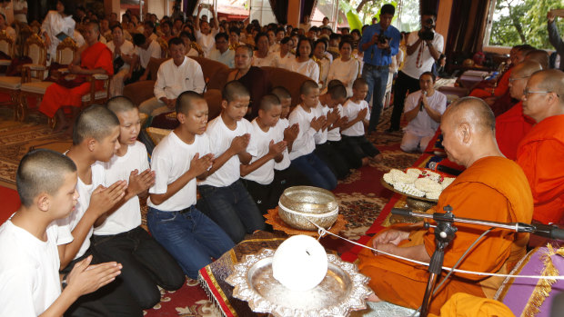 Members of the Wild Boars soccer team serving as novice Buddhist monks.
