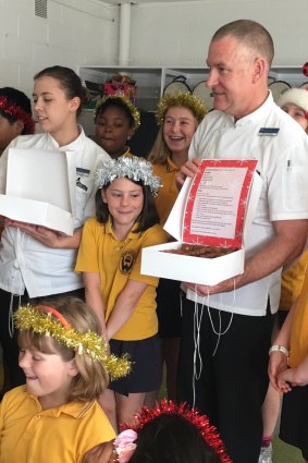 Calli from Weetangera School only had eyes for the brownies when Executive Chef from Parliament House David Learmonth visited the school