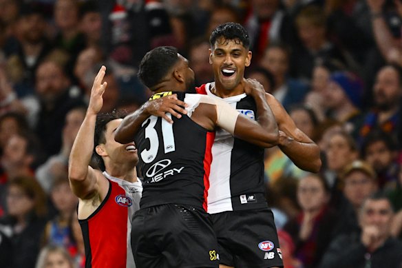 Liam Ryan of the Saints is congratulated by Nasiah Wanganeen-Milera after kicking a goal.