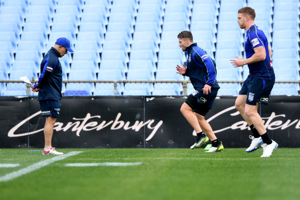 Kieran Foran is put through his paces as Dogs medico Tony Ayoub (left) looks on.