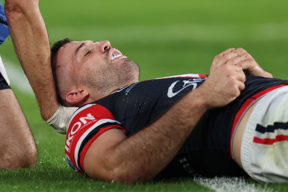 James Tedesco on the ground after copping a knock to the head.