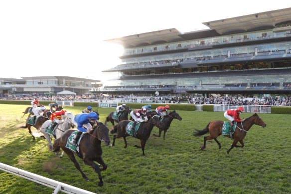 Promise Of Success (right) storms to victory in the last race of Everest Day at Randwick.