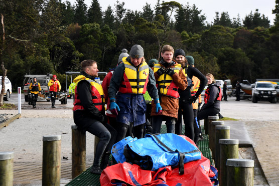 Rescue teams prepare to head out on the water at Macquarie Harbour on Thursday.
