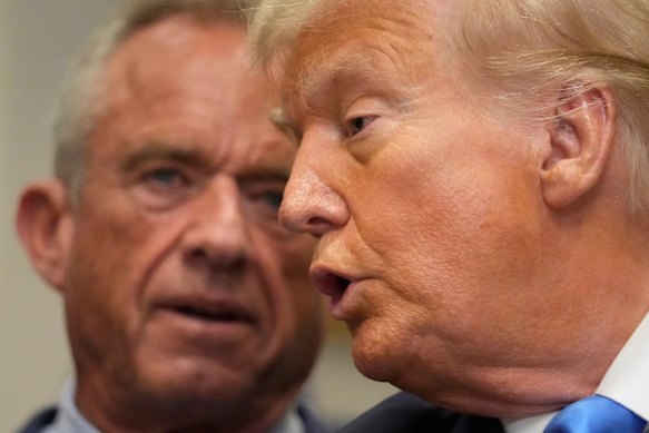 Trump speaks as Health and Human Services Secretary Robert F. Kennedy Jr. watches on.