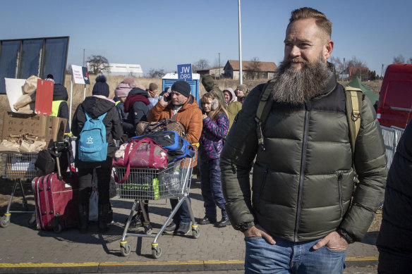 On the lookout for traffickers: Former French Foreign Legion member identified as Mornay at the Ukraine border crossing in Medyka, south-eastern Poland, on Friday.
