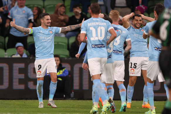 Jamie Maclaren and City teammates celebrate. 