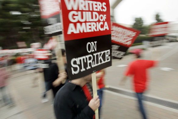 In 2007, picketers march outside the entrance to Sony Pictures Studios in Culver City, California. 