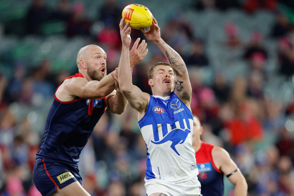 Max Gawn of the Demons and Cameron Zurhaar of the Kangaroos compete for the ball.