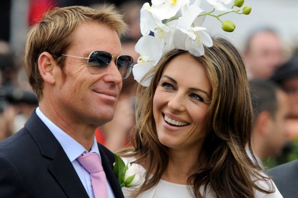 That Warnie charm: Shane Warne with ex-fiancee Liz Hurley in 2011. 