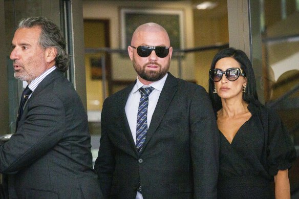 Daniel Gatto, 38, middle, leaves Melbourne Magistrates Court.