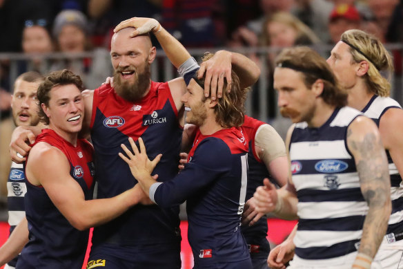 Max Gawn celebrates with teammates.