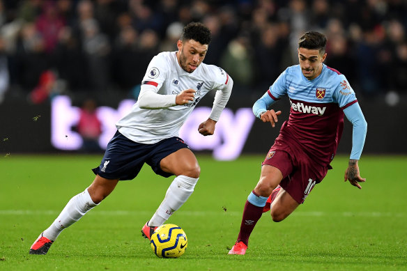 Alex Oxlade-Chamberlain, left, and Manuel Lanzini, right, in action. 