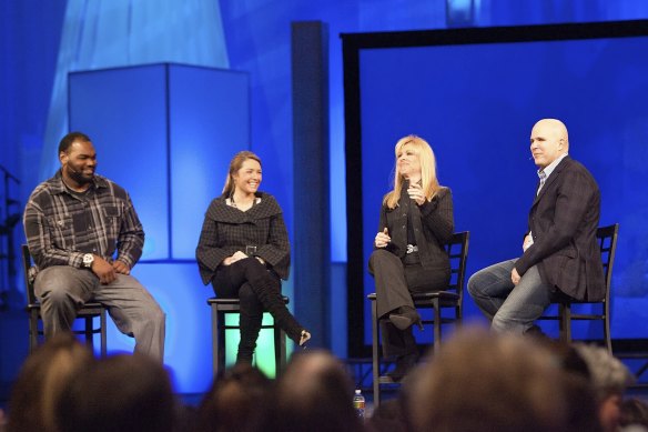 Happier days: Michael Oher, left, Collins Tuohy, second from left, and Leigh Anne Tuohy, whose lives are portrayed in The Blind Side, speak with Pastor Kerry Shook, right, in 2010.