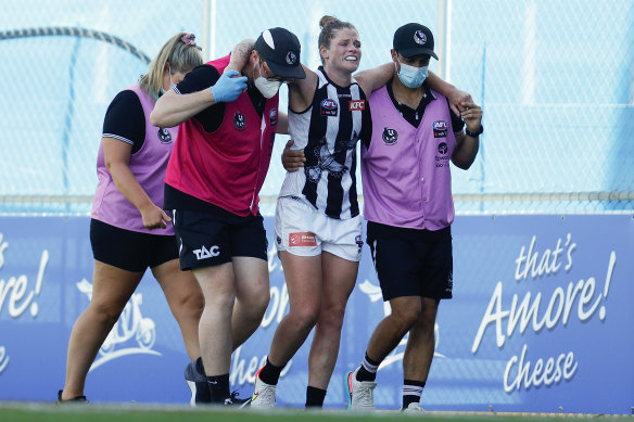 Brianna Davey leaves the field injured in round one. 