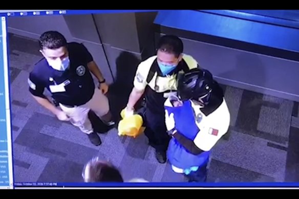 Surveillance camera footage obtained by the website Doha News shows officials care for an abandoned baby at Hamad International Airport in Doha, Qatar on October 2, 2020.