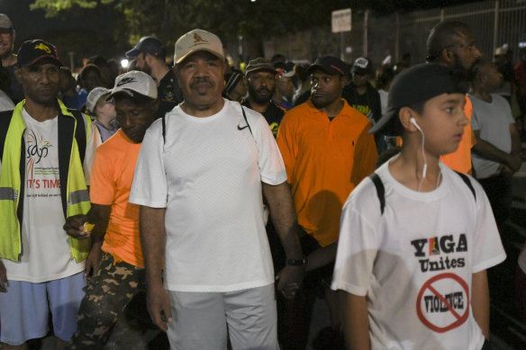 Port Moresby Governor Powes Parkop (centre) on his predawn walk with citizens.