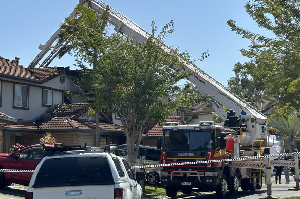 Emergency service crews at the scene of a fatal house fire in Thorneside.