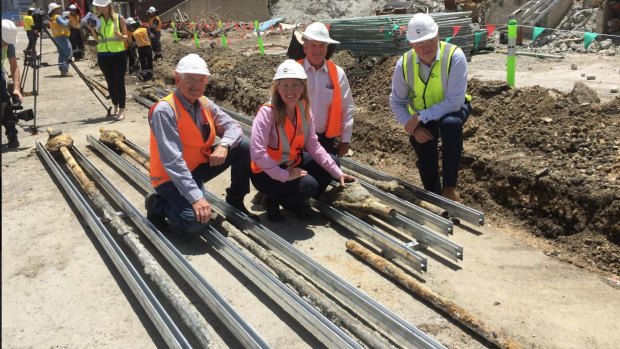 Tourism Industry minister Kate Jones with Destination Brisbane project director Simon Crooks (right) at the unearthing of the 134-year-old electrical cables.