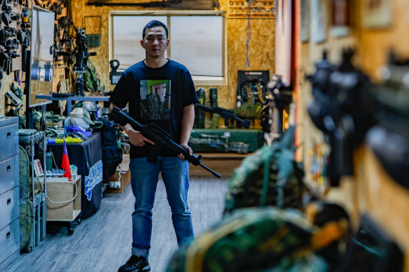 Tony Lu, 35, gives talks to school students at Taiwan Airsoft and Airgun Association about his experience fighting in Ukraine in 2022. He is wearing a T-shirt with the portrait of his friend, Australian Trevor Kjeldal, who died in battle in Ukraine.