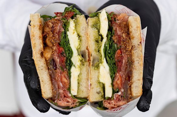 The prosciutto panino is filled with  San Daniele prosciutto,  Floridia Cheese fior di latte, rocket and housemade basil pesto.