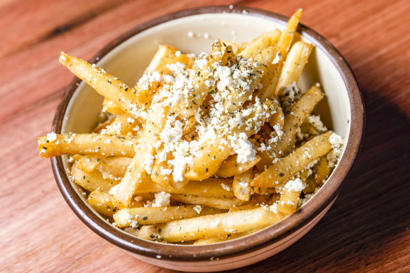 Chips live up to their full potential with the addition of feta, garlic oil and oregano.