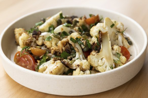 Roasted cauliflower salad with tomato, dill, capers and seeds.