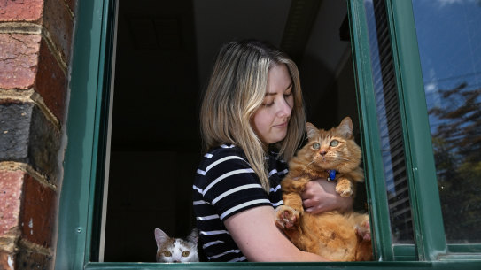 Saah Lowres with her ginger outdoor cat Gidget and (