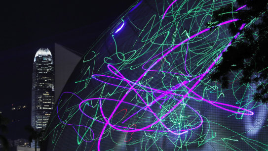 Protesters use laser pointers to light the Hong Kong Space Museum during a rally to demonstrate against the arrests of people caught in possession of laser pointers early on Wednesday morning.