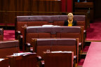 Labor senator Fatima Payman sits alone in the Senate on Thursday.