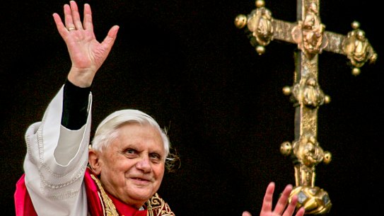 Pope Benedict XVI greets the crowd from the central balcony of St. Peter’s Basilica at the Vatican soon after his election on April 19, 2005.