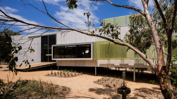 The Airey’s Inlet house is constructed from compressed cement panels and pearlescent-coloured translucent fibre-reinforced plastic.