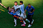 Spain’s Gavi falls as he scuffles with Argentina’s Leandro Paredes.