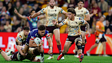 Chanel Harris-Tavita goes over against the Broncos.