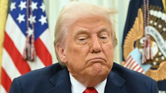 President Donald Trump speaks to reporters before signing an executive order in the Oval Office.