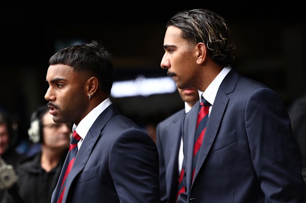 Melbourne players Kysaiah and Latrelle Pickett at the state funeral. 